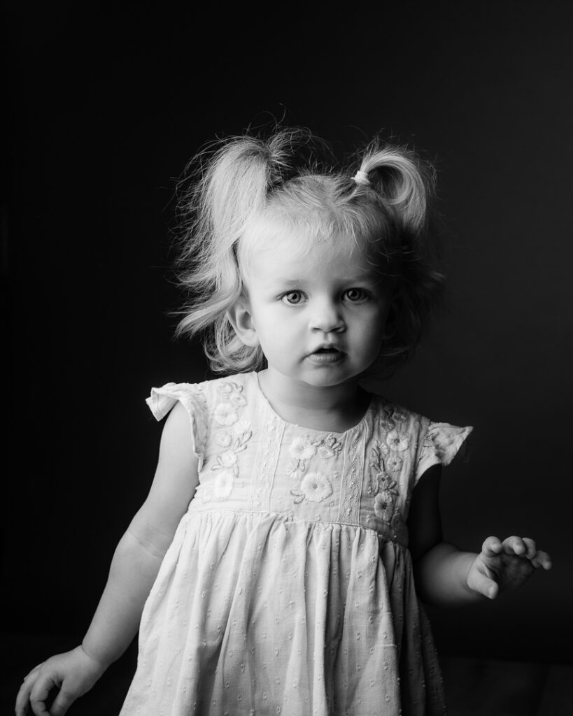 Beautiful black and white portrait of a single child taken at a Monmouthshire family photography studio.